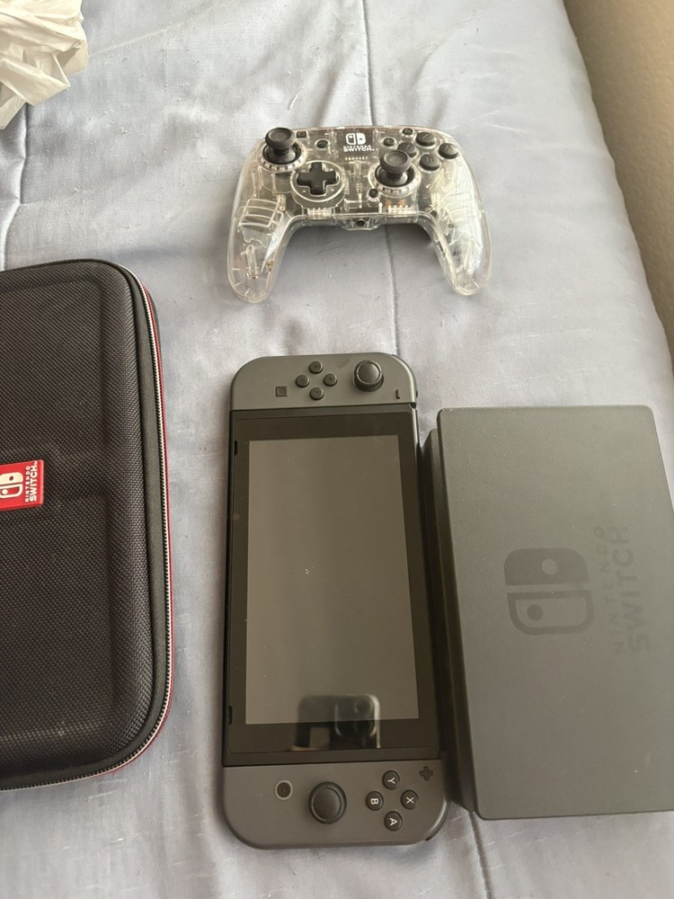 Nintendo Switch Handheld Console Gray Joy-Cons with dock and a case.