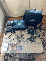 Xbox console, three controllers, carryting case, 2 games, and more