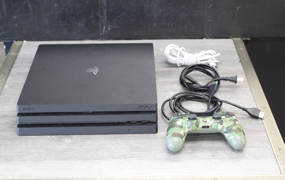 Sony PlayStation 4 Pro 1TB Game Console – Jet Black with Camo Controller