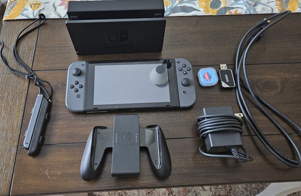 Nintendo Switch with Joycons, 256 micro SD, HDMI Cable, Dock, and power cable.