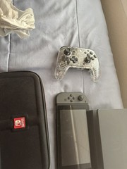 Nintendo Switch Handheld Console Gray Joy-Cons with dock and a case.