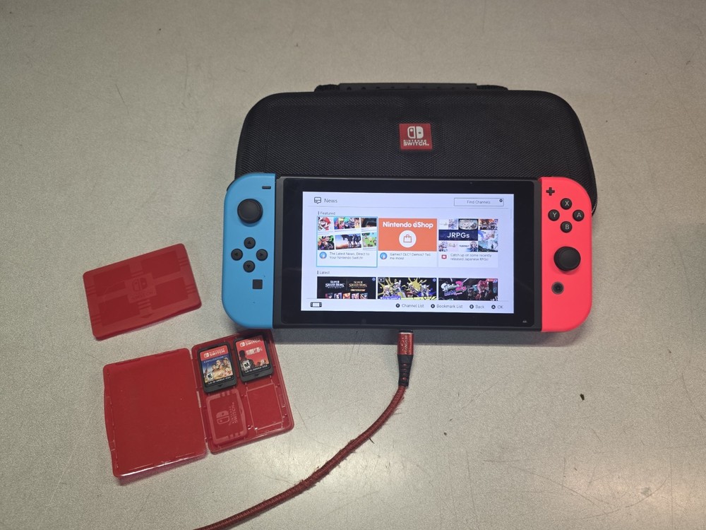 Nintendo Switch Console Red/ Blue w/ case & 3 Games