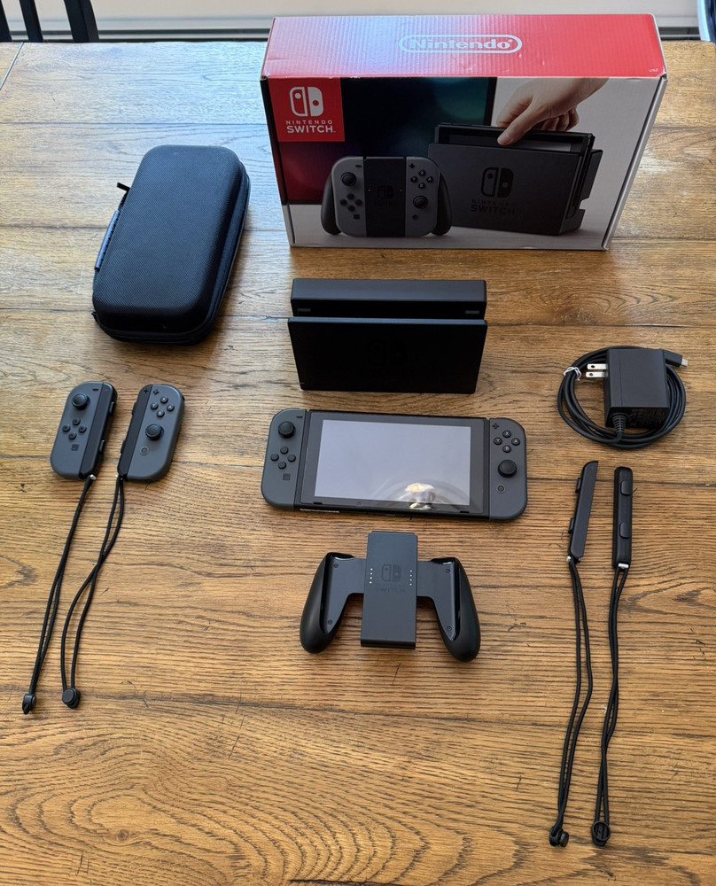 Nintendo Switch with 2 extra joy-cons, dock, holder, case, charger, SD, and box