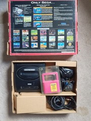 Complete Sega Genesis 16 bit video entertainment system with extra controller