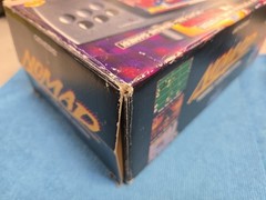 Sega Nomad Console. With Box (no inserts). A/C adaptor. Battery holder missing..