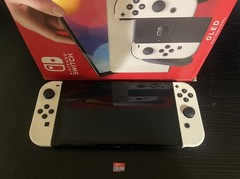 Nintendo Switch OLED with 128GB Micro SD Card, Original Box, & Handheld Grip