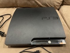 PlayStation 3 console with all necessary cords and 2 controllers