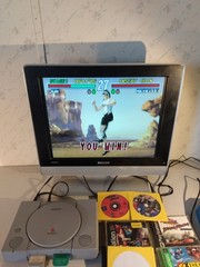 PS1 Action Bundle w/ hook ups, fighting stick & 2 official PS memory cards