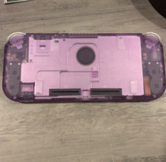 Nintendo Switch lite shell swapped with eXtremeRate clear atomic purple shell.