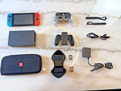 Nintendo Switch 32GB Console with Neon Red and Blue Joy-Cons and A controller