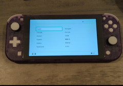 Nintendo Switch lite shell swapped with eXtremeRate clear atomic purple shell.