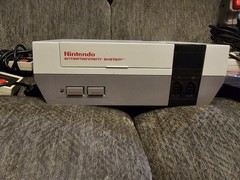 Original NES Console With Controllers, Hookups, Guns, Joysticks And Mega Man 2