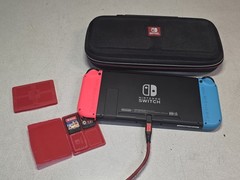 Nintendo Switch Console Red/ Blue w/ case & 3 Games