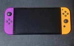 Nintendo Switch OLED Model – White – Orange Purple Joycons + 64gb Sandisk