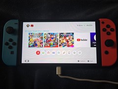 Nintendo Switch OLED Bundle W/2 Controllers, 3 Digital Mario games- USED In Box