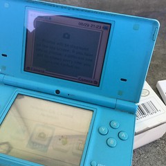 Nintendo DSi Light Blue Handheld Console w/Box, Nintendog, & Instruction Booklet