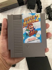 authentic NES Console Bundle with Super Mario Bros. 1,2,3 and 2 Controllers gun