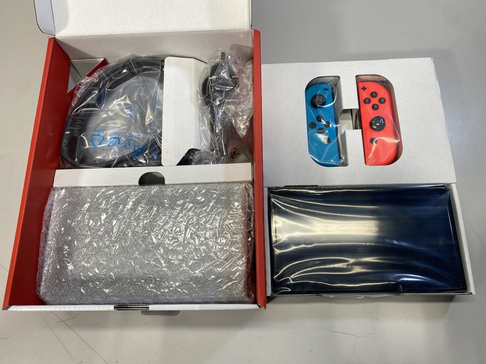 Nintendo Switch OLED Handheld Console With Red/Blue Joy-Con – 64GB