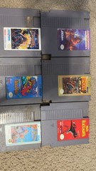 2 NES Systems 2 power cords 1 RF Switch Cable 2 Controller. 39 Different Games.