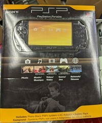 brand new sealed Sony PSP 2000 Launch Edition 64MB Handheld System – Piano Black