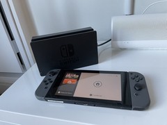 Nintendo Switch with Gray Joy Cons + Dock + Mario Tennis Aces + Extra Controller