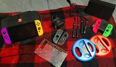 Nintendo Switch plus dock, joycons, steering wheel, game accessories, etc lot