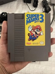 authentic NES Console Bundle with Super Mario Bros. 1,2,3 and 2 Controllers gun