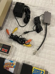 authentic NES Console Bundle with Super Mario Bros. 1,2,3 and 2 Controllers gun