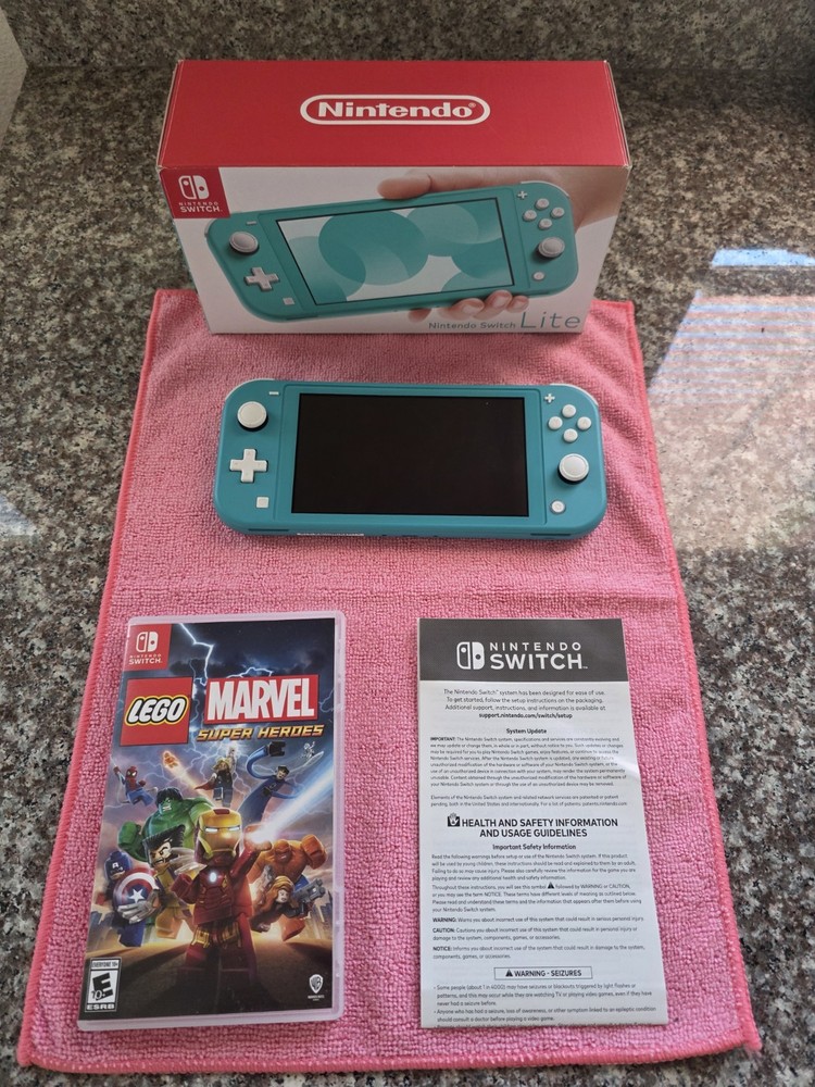 Nintendo Switch Lite Handheld Console – Turquoise With Game And Charger.