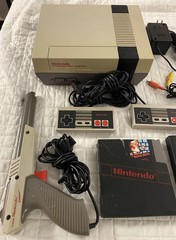 authentic NES Console Bundle with Super Mario Bros. 1,2,3 and 2 Controllers gun