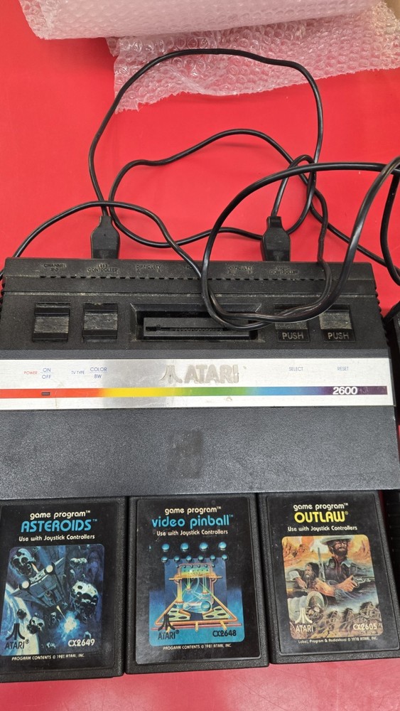 Atari 2600 Black Console w/ 2 Joysticks and 5 games 1 unknown
