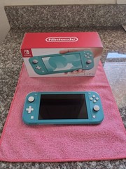 Nintendo Switch Lite Handheld Console – Turquoise With Game And Charger.