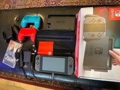Nintendo Switch 32GB Gray Console with Neon Red and Neon Blue Joy-Con.